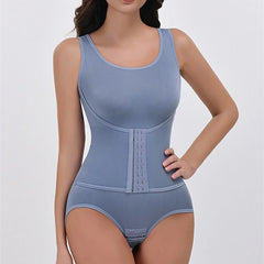 Blue shapewear bodysuit on a model against a plain background
