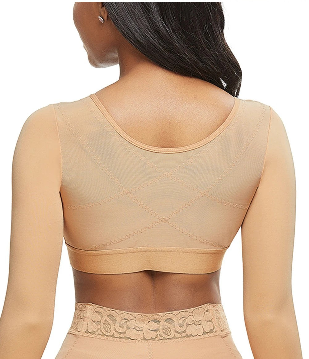 Beige shapewear top worn by a model on a white background
